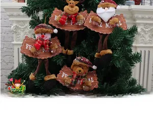 Plush Christmas ornaments set with Santa, elk, and snowman on a green pine tree