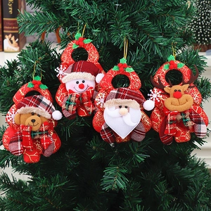 Set of 4 festive Christmas ornaments featuring Santa and Snowman on a green Xmas tree