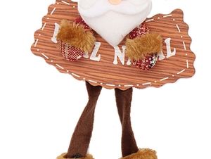 Close-up of Santa Claus plush ornament holding a wooden Feliz Natal holiday greeting sign