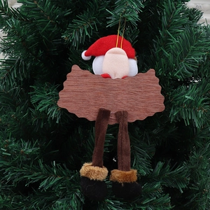 Plush Santa Claus wooden sign pendant hanging on a green Christmas tree branch