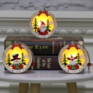 Lighted wooden Christmas ornaments featuring Santa, Snowman and Reindeer with warm LED glow
