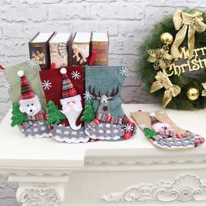 Set of 4 Christmas stockings with Santa, Reindeer, Snowman, and Bear on a white mantel