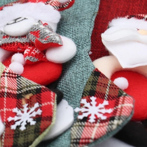 Christmas burlap stockings featuring 3D Santa and polar bear with festive plaid accents