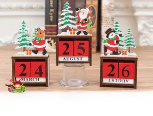 Detail of Christmas wooden advent calendar featuring Santa and reindeer on a desk