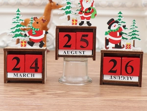Close-up of wooden Christmas perpetual calendar with hand-painted deer and Santa Claus decor