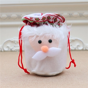 Detail of drawstring Christmas gift bag with 3D Santa Claus face and plush knit fabric