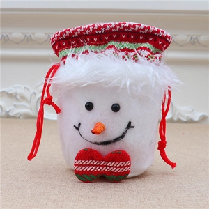 Close-up of snowman drawstring Christmas gift bag with knit trim and 3D plush details