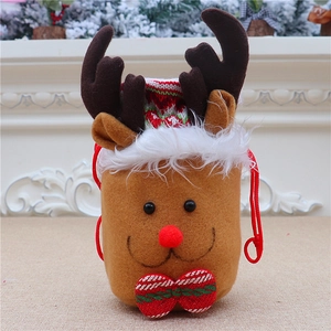 Detail of Christmas reindeer gift bag with plush trim, red drawstring and striped bow