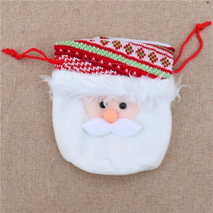 Detail of Christmas drawstring gift bag with white faux fur and red knit pattern