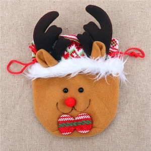 Detail of Christmas reindeer drawstring gift bag with brown felt and red pom-pom nose