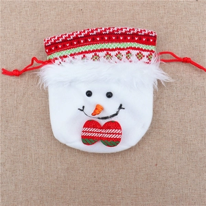 Detail of a plush snowman Christmas drawstring gift bag with a red textured bow