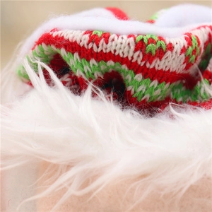 Detail of Christmas knitted bag showing festive wavy patterns and soft plush white trim