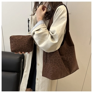 Detail of leopard print tote bag and small pouch set in premium faux suede finish