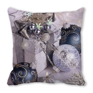 Detailed close-up of Christmas pillowcase featuring gift boxes and blue ornaments on white