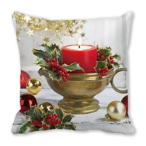 Detailed view of Christmas pillowcase featuring candle and holly on white wood