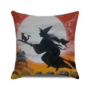 Detail of Halloween pillowcase with witch silhouette and black cat on linen texture