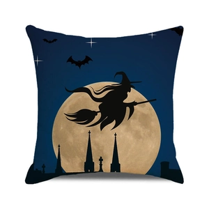 Detail of Halloween pillow case featuring a witch silhouette and orange pumpkin moon
