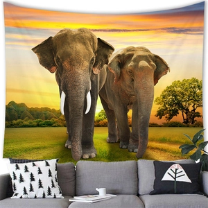 Detailed elephant sunset tapestry showing realistic wildlife print on wall above modern sofa