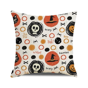 Detail shot of Halloween pillow cover featuring black cat, skull and pumpkin patterns