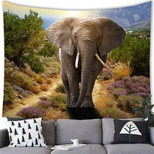 Detail of African elephant tapestry hung as cozy wall decor above a grey living room sofa