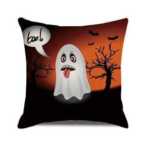 Detail of Halloween pillow case featuring a white ghost, bats, and boo text on orange background