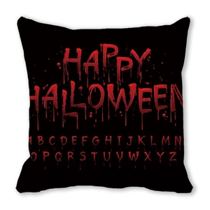 Macro shot of Halloween cushion cover with red bloody letters and alphabet on black fabric