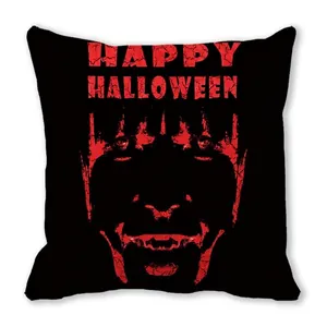 Detail of Happy Halloween pillow case showing the red clown face print on black fabric