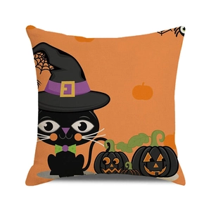 Detail of Halloween pillow case with cartoon black cat and pumpkin on orange canvas
