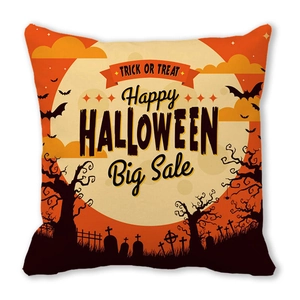 Detail of Halloween throw pillow featuring spooky castle, orange moon, and festive text
