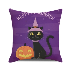 Macro detail of Halloween pillowcase with black cat, orange pumpkin and purple theme