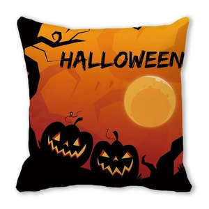 Close-up of Halloween pillowcase with pumpkin and castle graphics on orange fabric