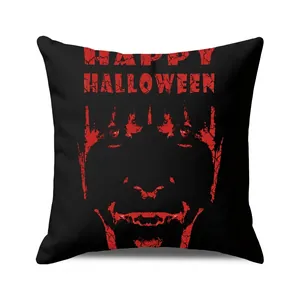 Close-up of Happy Halloween cushion cover with red spooky face and bold text details