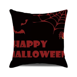 Detail of square Halloween cushion cover with red spider web and bats on black fabric