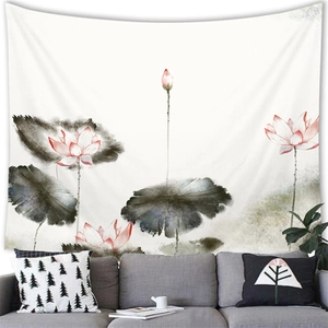 Detail of Chinese ink wash tapestry with pink lotus flowers hanging over a gray sofa