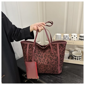 Detail of dark red leopard print tote bag with matching small coin purse attachment