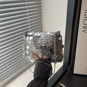 Silver sequin shoulder bag with metal chain strap and reflective metallic finish
