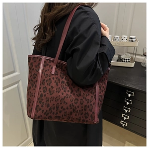 Close-up of the red leopard print fabric texture on a large capacity tote bag