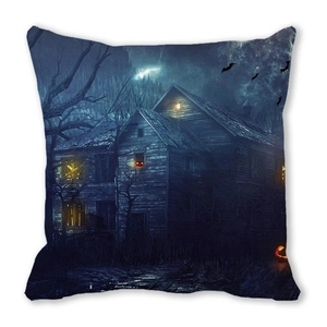 Macro detail of square Halloween pillow cover featuring a spooky haunted house design