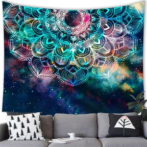 Starry sky mandala tapestry displayed on wall behind a sofa in a modern living room