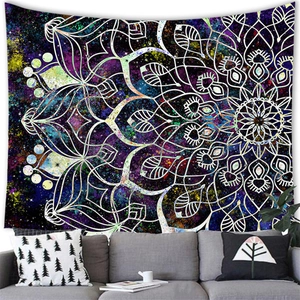 Mandala tapestry with starry sky background hanging over a modern sofa in a living room