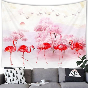 Detail of flamingo tapestry with tropical leaves hanging above a gray sofa in a living room