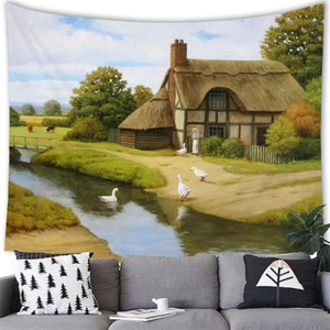 Oil painting landscape tapestry showing an English country cottage over a sofa in a cozy room