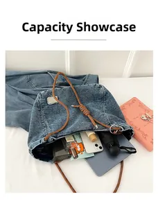 Capacity display of denim tote bag showing interior storage for tablet and daily items