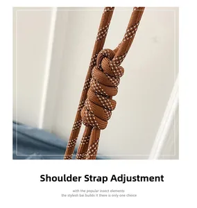 Detailed close-up of adjustable brown woven rope shoulder strap with white dotted texture