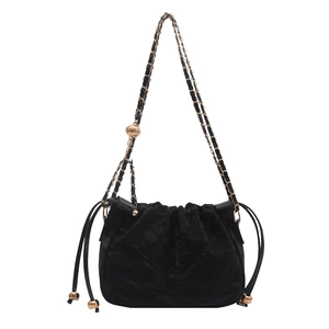 Elegant black velvet drawstring bucket bag with gold chain strap for women