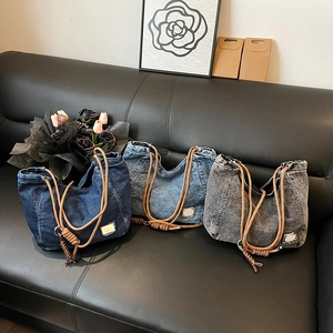 Vintage denim tote bags with thick rope handles shown in three blue and gray washed shades