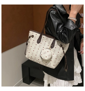 Detail of a minimalist bear print tote bag set featuring matching round coin purse detail