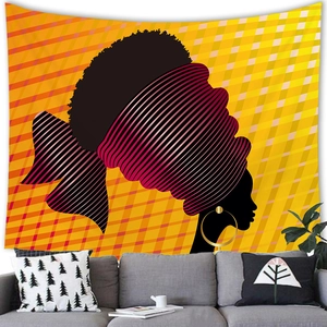 Detail of African woman silhouette tapestry hung above a sofa in a modern living room