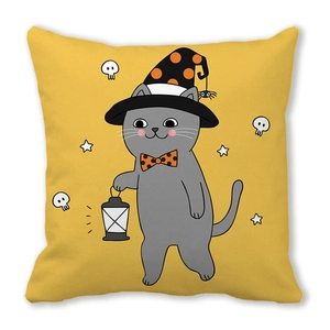 Detail of Halloween pillow featuring a cartoon cat in a wizard hat holding a vintage lantern