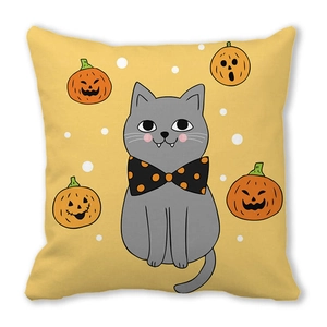Detail of Halloween cat and pumpkin lantern print on a soft peach skin cushion cover